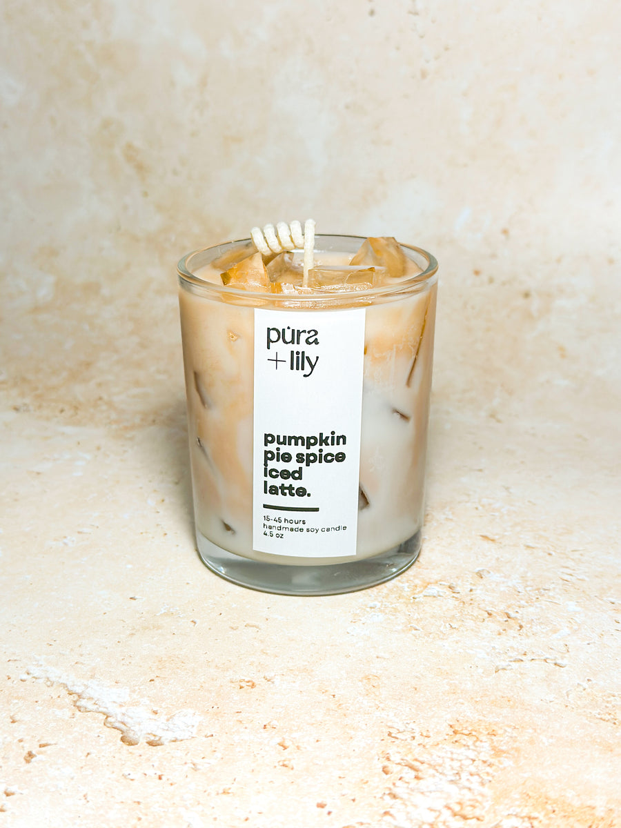 Pura+co Latte Lover' Dream Candles | Collab with Lily de Parcha | Pumpkin Pie Spice Iced Latte Matcha Candle sits on a stone surface