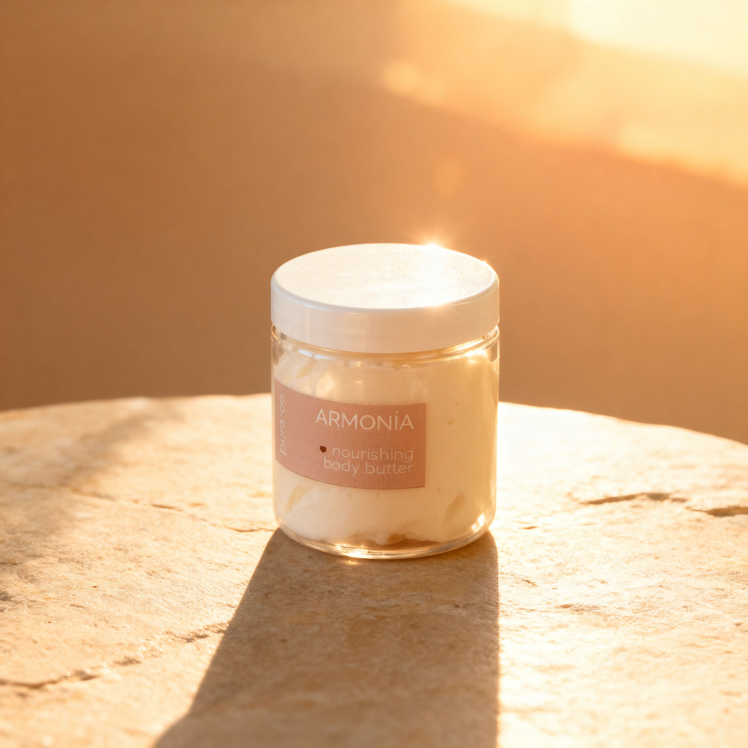 Pura+Co | The Armonia body butter jar sits on a stone surface |  Grapefruit Mint Scent | Handmade Skin Care | Puerto Rico