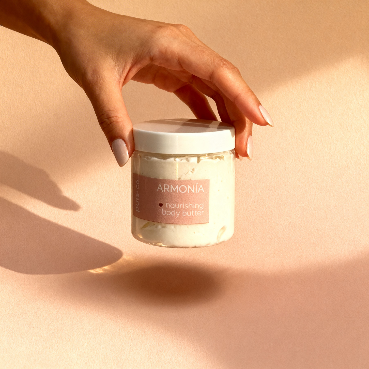 Pura+Co | The Armonia body butter jar is being placed on a surface |  Grapefruit Mint Scent | Handmade Skin Care | Puerto Rico