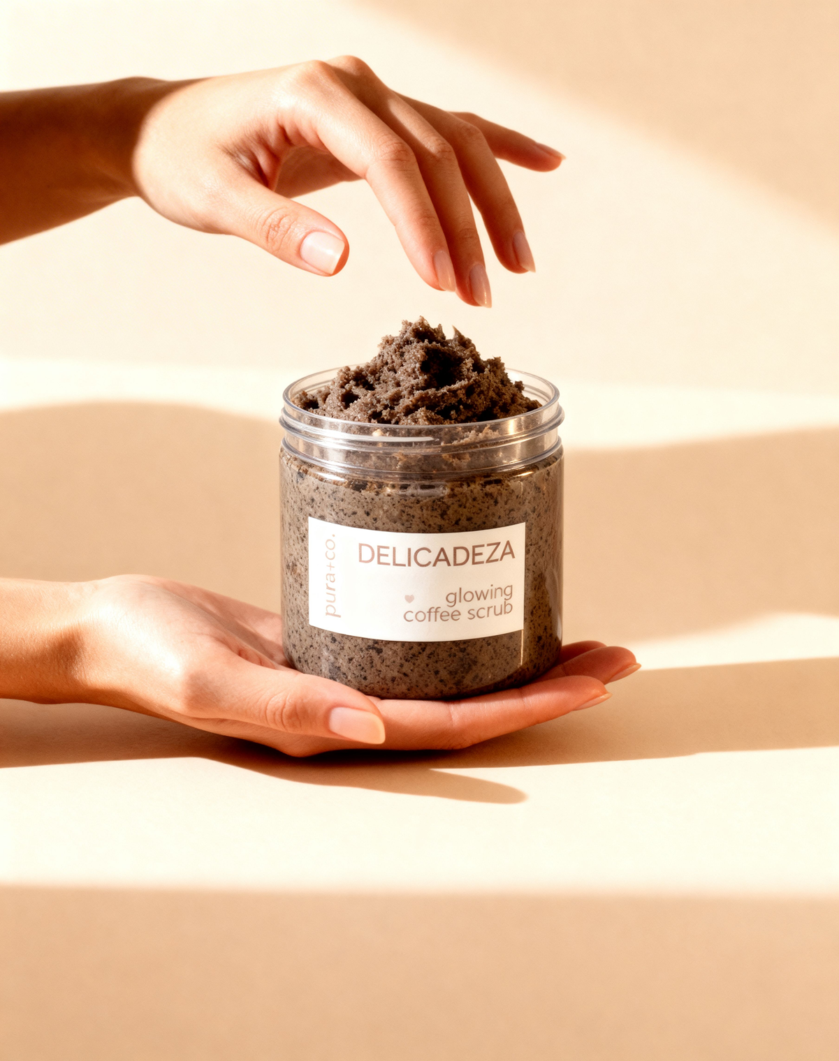 Pura+Co | Hands reach in the Delicadeza coffee Scrub jar | Exfoliante Natural |  Oatmeal Honey Scent | Handmade Skin Care | Puerto Rico
