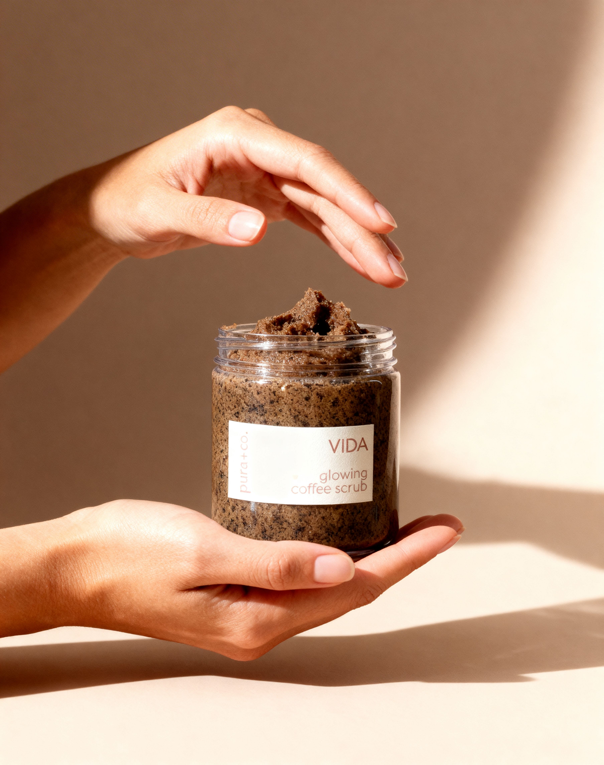Pura+Co | Hands reach in the Vida Coffee Scrub jar | Exfoliante Natural |  Amber & Mandarin Scent | Handmade Skin Care | Puerto Rico