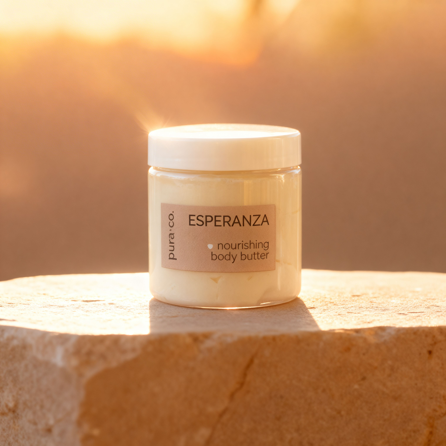 Pura+Co | The Esperanza body butter jar is shown on a stone surface |  White Tea and Eucalyptus Scent | Handmade Skin Care | Puerto Rico