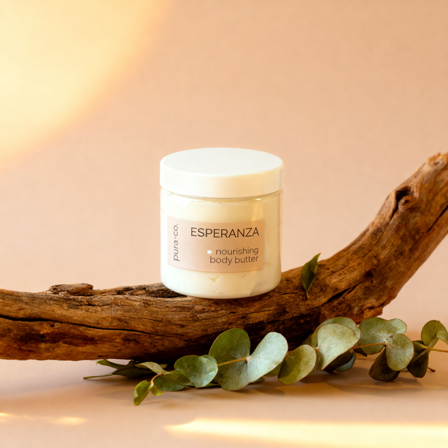 Pura+Co | The Esperanza body butter jar sits on a branch spotlighted |  White Tea and Eucalyptus Scent | Handmade Skin Care | Puerto Rico