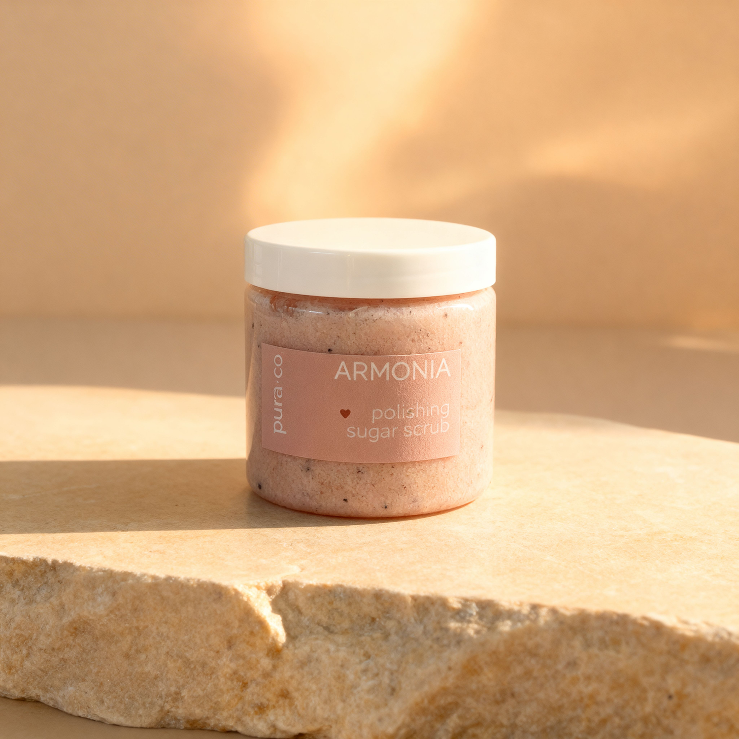Pura+Co | Armonía Sugar Scrub jar sits on a stone surface | Exfoliante Natural |  Grapefruit & Mint Scent | Handmade Skin Care | Puerto Rico