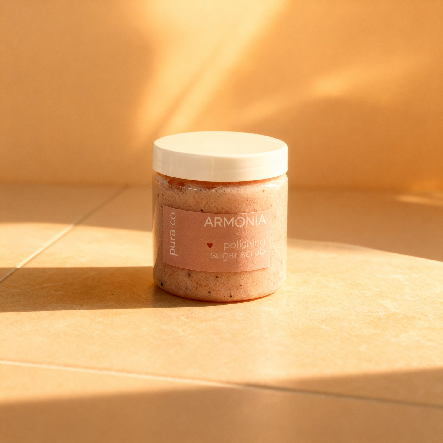 Pura+Co | Armonía Sugar Scrub jar sits on a tiled surface | Exfoliante Natural |  Grapefruit & Mint Scent | Handmade Skin Care | Puerto Rico