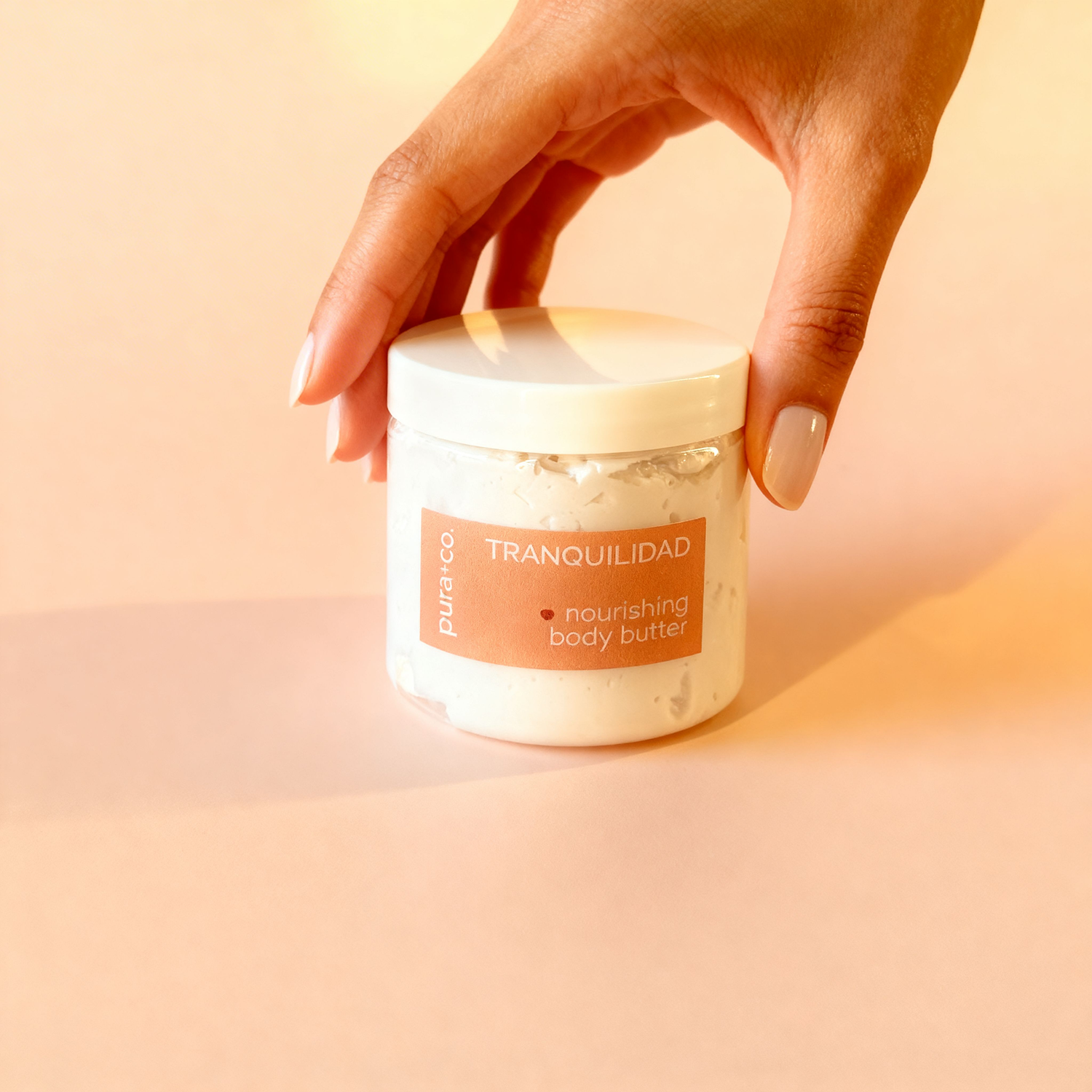 Pura+Co | The Tranquilidad body butter jar is placed on a  surface | Lavender and Vanilla Scent | Handmade Skin Care | Puerto Rico